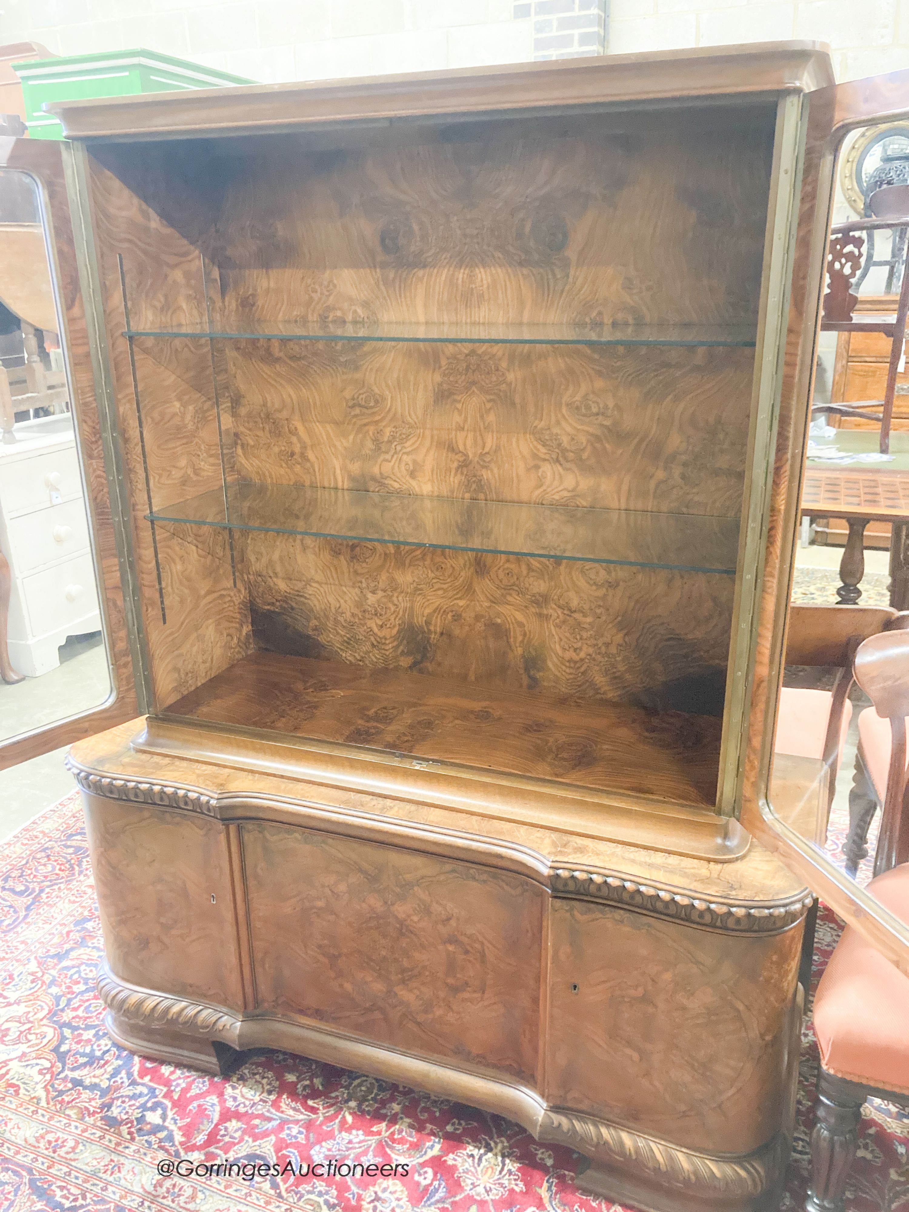 A 1930's walnut veneered china display cabinet combined cupboard, length 130cm, depth 46cm, height 165cm